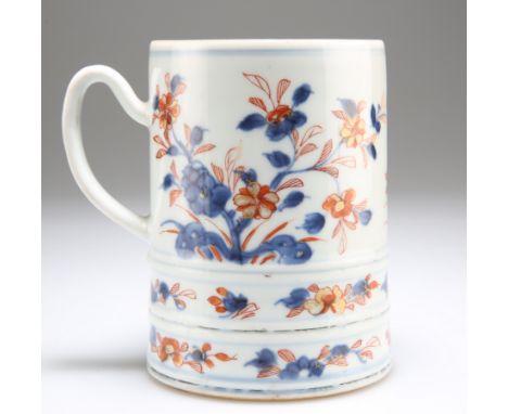 AN 18TH CENTURY CHINESE IMARI TANKARD, the slightly tapering cylindrical body with three pairs of moulded bands to the lower 