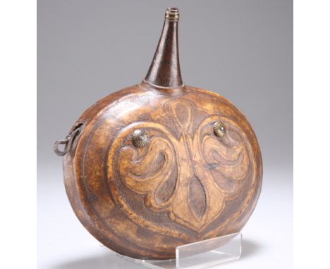 A LEATHER POWDER FLASK, MIDDLE EASTERN OR NORTH AFRICAN, moon shaped with iron fittings. 16cm wide