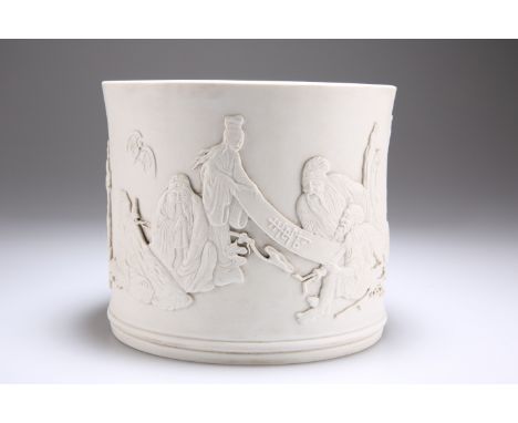 A CHINESE UNGLAZED BISCUIT PORCELAIN BRUSH POT, moulded and carved in relief with scholars, musicians, bat and bamboo, bears 