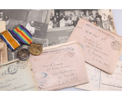 A COLLECTION OF WWI PRISONER OF WAR (POW) LETTERS, A PHOTOGRAPH ALBUM AND TWO WWI MEDALS, RELATING TO SECOND LIEUTENANT CLARE