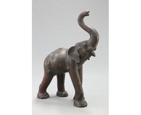 AN UNUSUALLY LARGE LEATHER MODEL OF AN ELEPHANT, modelled with trunk raised. Height 137.5cm&nbsp;