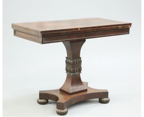 A 19TH CENTURY ROSEWOOD FOLDOVER CARD TABLE BY GILLOW &amp; CO, with bead and reel moulded frieze, raised on a leaf carved wa