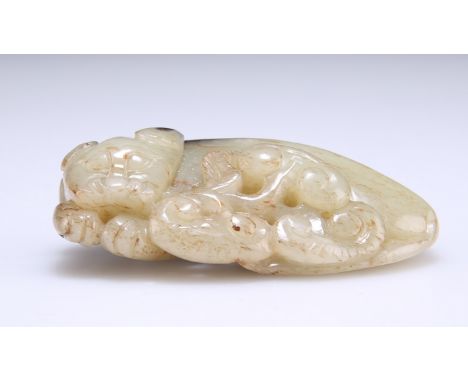 A CHINESE JADE CARVING OF A CAT, the stone with russet and black markings. 7cm wide