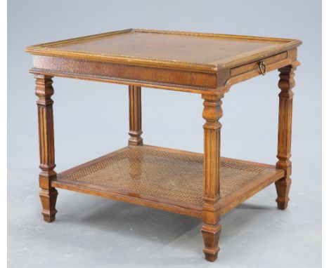 A CONTEMPORARY WALNUT OCCASIONAL TABLE, the cross banded and quarter veneered rectangular top above a slide, raised on fluted