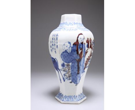 A CHINESE PORCELAIN VASE, of hexagonal-section baluster form, the shoulder and foot with leaf-form moulding, painted with fig