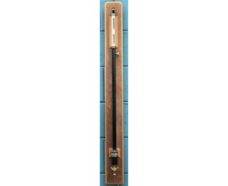 A BLACK LACQUERED AND BRASS BAROMETER, SIGNED F. DARTON AND CO LIMITED, LONDON, on a hardwood board. 115cm high overall&nbsp;