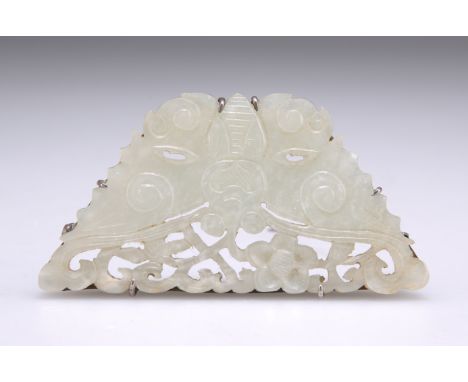 A CHINESE SILVER-MOUNTED PALE CELADON JADE BROOCH, pierced and carved as a butterfly. 6.5cm wideThe absence of a Condition Re