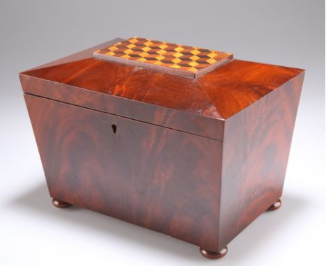 A 19TH CENTURY MAHOGANY TEA CADDY, sarcophagus form, the hinged cover with parquetry inlaid decoration and opening to reveal 