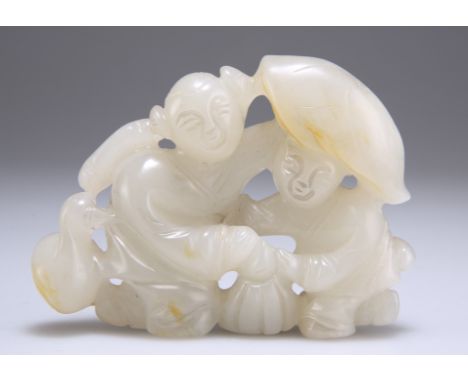 A CHINESE CARVED AND PIERCED PALE JADE FIGURE GROUP. 9cm wide