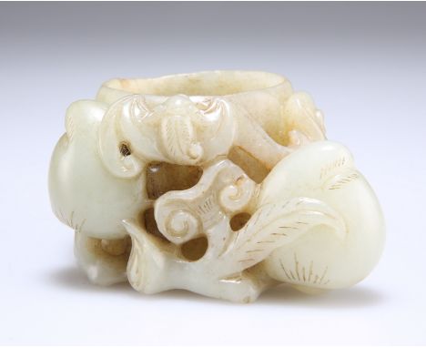 A CHINESE PALE CELADON AND RUSSET JADE BRUSH WASHER, carved with fruit, bat and tendrils. 8.5cm wide
