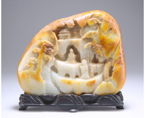 A LARGE CHINESE PALE CELADON AND RUSSET JADE BOULDER CARVING, PROBABLY QING DYNASTY, one side carved with figures, pagoda and