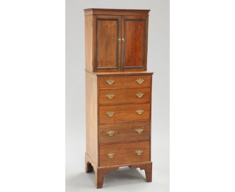 AN UNUSUAL EDWARDIAN MAHOGANY CABINET ON CHEST, the superstructure with a pair of panelled doors over five long graduated dra