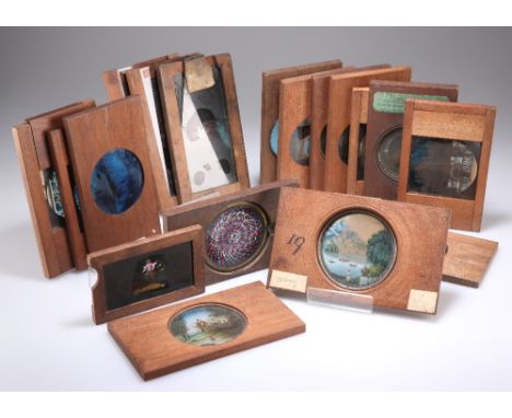 EIGHTEEN VARIOUS 19TH CENTURY MAHOGANY MOUNTED MAGIC LANTERN SLIDES, including hand painted and tinted photographic examples;