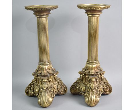 A Pair of Modern Gilt Resin Candlesticks with Scrolled Tripod Base and Reeded Column Support, 28cms High