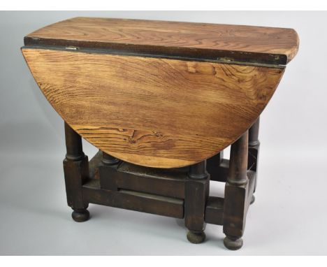 A Mid 20th Century Oak Drop Leaf Oval Topped Gate Leg Coffee Table, 60cms Long