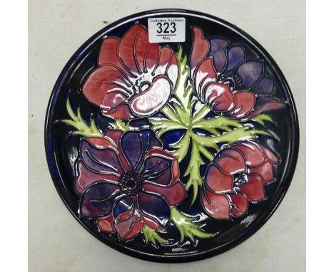 Moorcroft larger plate in the New Anemone pattern: Measures 26cm wide. Light localised crazing to some areas of glaze. 