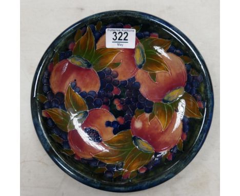 Moorcroft mid century plate in the Pomegranite pattern: Measures 22cm wide. Light localised crazing to some areas of glaze. 