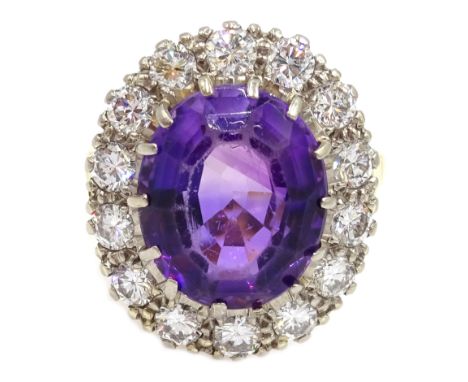 Gold oval amethyst and diamond cluster ring, stamped 18ct Condition Report Approx 7.5gm, size L, overall head size = 20mm x 1