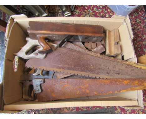a tray of vintage saws and tools