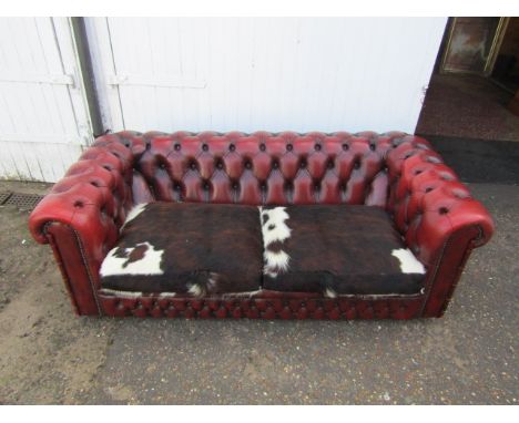 Ox blood Chesterfield sofa with cow hide seat covers&nbsp;