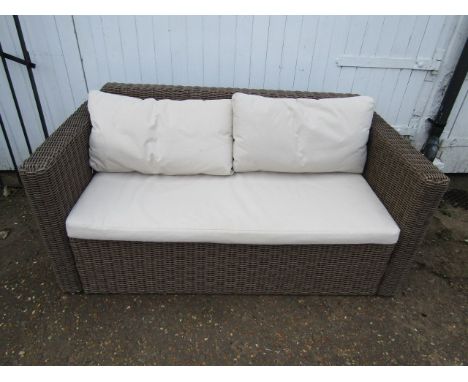 A Rattan garden sofa in good clean condition