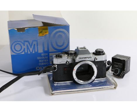 Olympus OM10 camera body, together with an OM10 manual adapter, both in original packaging (2)
