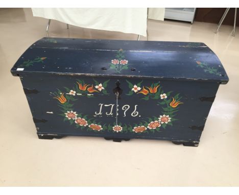 A Scandinavian blue painted trunk in traditional manner, painted date to front 1796: plank construction blanket box and candl