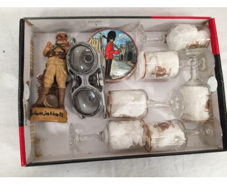 Six 'The Rats of Tobruk' glasses, model of a soldier, military pot lid and skeleton binoculars