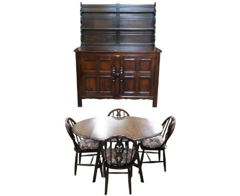 A mid 20th century stain elm and beech Ercol dining suite consisting drop leaf dining table, 72cm high x 123cm wide x 115cm d