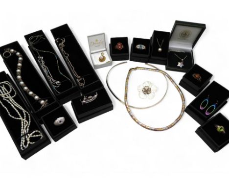 A collection of silver and white metal items to include a pair of rainbow titanium earrings, silver peridot ring, silver and 