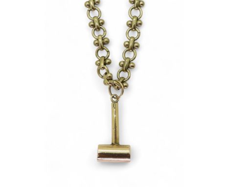 A yellow metal handmade Masonic gavel pendant weight 9.1gms, together with a gold plated chain Condition Report:Available upo