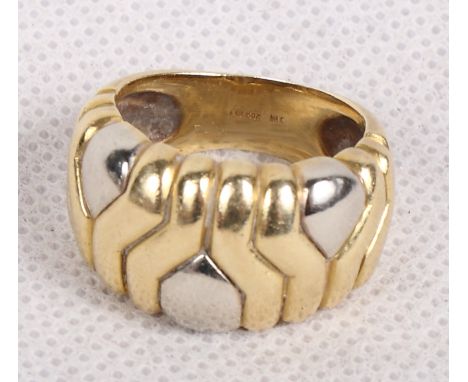 An 18ct gold dress ring with textured decoration, 11.1g