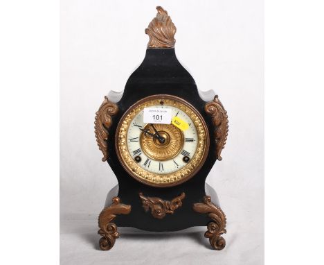 An Ansonia mantel clock in black metal "slate" case of Louis XV design with gilt metal mounts, 14" high