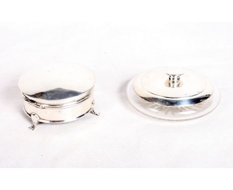 A circular silver ring box and a cut glass and silver mounted powder pot