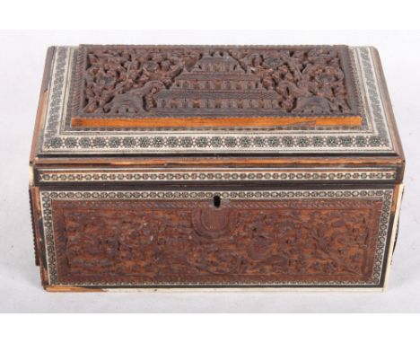 A late 19th Century Indian carved hardwood and marquetry work two-division tea caddy, 10" wide