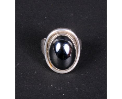 A Georg Jensen silver "Moonlight" ring, No. 46A, set polished hematite cabochon