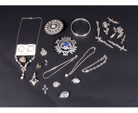 A silver and lapis mounted brooch, another silver brooch, a silver bangle and a quantity of other silver jewellery and charms