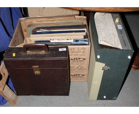 An original Dansette Viva portable record player and a collection of records, mostly classical 78s and 33s