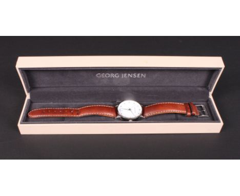 A Georg Jensen stainless steel cased wristwatch with white enamel dial and date aperture at 6 o'clock, designed by Henning Ko