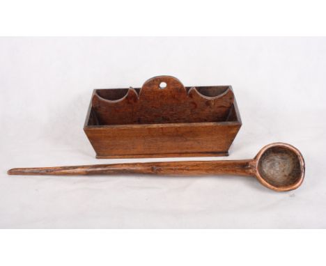 A carved wooden ladle and a 19th Century wooden cutlery box