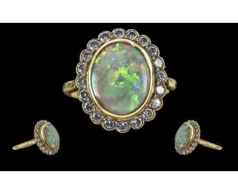 Ladies 18ct Gold Opal and Diamond Set Ring with Full Hallmark to Shank, The central large opal of pleasing colour, Est 6.00 c