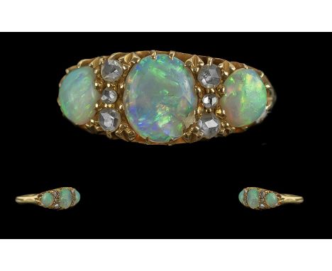 Victorian period 1837 - 1901 pleasing quality ladies 18ct gold opal and diamond set ring, gallery setting. the oval shaped op