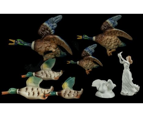 Two Sets of Flying Birds, one Falcon Ware Ducks No 1402 a set of three graduated mallard duck wall plaques, and a further set