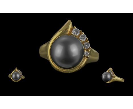 Ladies Pleasing Quality 18ct Gold Black Pearl and Diamond Set Ring, marked 750 - 18ct to interior of shank; the large culture