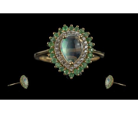 Emerald and Opal Cabochon Stylish Ring, size S/T. comprising a pear cut cabochon jelly opal, framed with a closely set row of