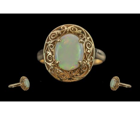 Antique period 18ct gold single stone opal set ring, with open worked ornate mount / shank, marked 18ct to interior of shank.