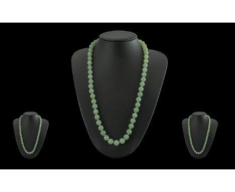 A 1930's Pleasing Jade Beaded Necklace - Well Matched. Length 23'' (57.5 cm) Weight 75.9 grams. All aspects of condition good