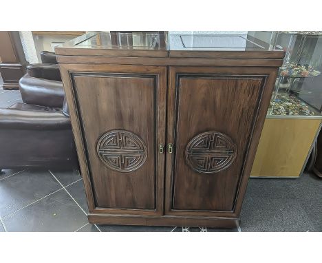 Chinese Style Cherrywood Drinks Cabinet, height 42.5'' x width 36'' x 19.5'' deep.  Hinged top, two doors, fitted interior wi