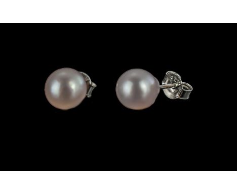 Japanese Akoya Pearl Stud Earrings, two of the high quality, famous Akoya pearls, known for their special beauty, set with rh