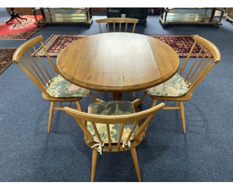 Ercol Small Kitchen Table, drop leaf, central pedestal, and Four Spindle Back Chairs with padded seat cushions.  